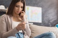 Worried girl reading the results of her pregnancy test Royalty Free Stock Photo