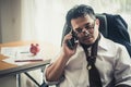 Worried business man at workplace in office after tired from hard work. Royalty Free Stock Photo