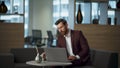 Worried businessman drinking espresso looking computer office. Man feeling tired Royalty Free Stock Photo