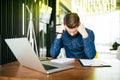 Worried businessman lamenting in front of a computer after a big mistake at office Royalty Free Stock Photo