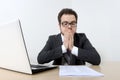 Worried businessman with laptop and document Royalty Free Stock Photo