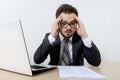 Worried businessman with laptop and document Royalty Free Stock Photo