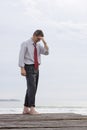 Worried businessman at the sea Royalty Free Stock Photo