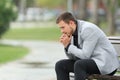 Worried businessman sitting on a bench Royalty Free Stock Photo