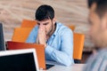 Worried businessman working at his desk in his office Royalty Free Stock Photo