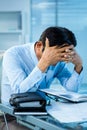 Worried businessman working at his desk Royalty Free Stock Photo