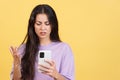 Worried caucasian woman using a mobile phone