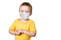 Worried child wearing a protective face mask to prevent corona virus infection or pollution on white isolated background