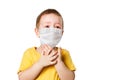 Worried child wearing a protective face mask to prevent virus infection or pollution on a white isolated background