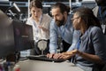 Worried computer scientists in data center reacting to virus alert