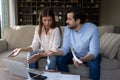 Worried concerned young couple doing paperwork at home Royalty Free Stock Photo