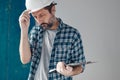Worried construction engineer project manager after reviewing notes Royalty Free Stock Photo
