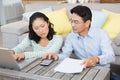 Worried couple checking bills Royalty Free Stock Photo