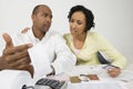 Worried Couple With Expense Receipt And Credit Cards Royalty Free Stock Photo