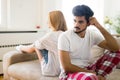 Worried couple having problems in bedroom Royalty Free Stock Photo