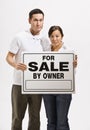 Worried Couple Holding For Sale Sign Royalty Free Stock Photo