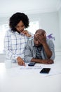 Worried couple interacting while checking the bills Royalty Free Stock Photo