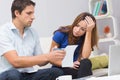 Worried couple paying bills online with laptop at home Royalty Free Stock Photo