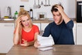 Worried Couple Reading Letter At Home Royalty Free Stock Photo