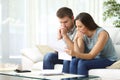 Worried couple reading a letter Royalty Free Stock Photo