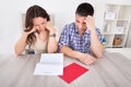 Worried couple reading paper Royalty Free Stock Photo