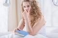 Worried curly girl in bed Royalty Free Stock Photo