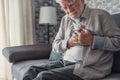 Worried elder senior man feeling bad, upset old middle aged grandfather touching chest feel sudden pain heartburn having heart Royalty Free Stock Photo