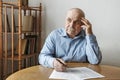 Worried elderly man completing a form Royalty Free Stock Photo