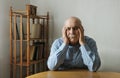 Worried elderly man with his head in his hands Royalty Free Stock Photo