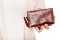 Worried elderly woman with empty wallet