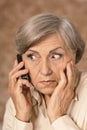 Worried elderly woman