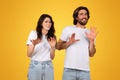 Worried young couple gesturing stop with their hands, showing signs of rejection or fear Royalty Free Stock Photo