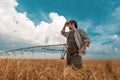 Worried farmer in barley field on a windy day Royalty Free Stock Photo