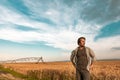 Worried farmer in barley field on a windy day Royalty Free Stock Photo