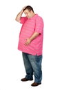 Worried fat man with pink shirt Royalty Free Stock Photo