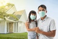 Worried father and daughter wearing face mask