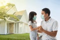 Worried father and daughter wearing face mask