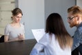 Worried female employee waiting during job interview