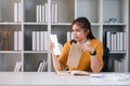 Worried frustrated woman shocked by bad news or rejection reading letter, stressed girl troubled with financial problem Royalty Free Stock Photo