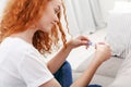 Worried girl reading the results of her pregnancy test Royalty Free Stock Photo