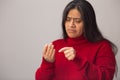 Worried Hispanic Woman Counts On Fingers