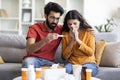 Worried Indian Man Taking Care Of His Ill Wife At Home Royalty Free Stock Photo