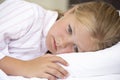 Worried Looking Young Girl In Bed Royalty Free Stock Photo