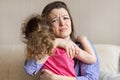 Worried loving mother hug, tightly hold crying baby sitting in her hands. young woman pity upset girl. Royalty Free Stock Photo