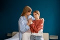 Worried loving woman mother hugging upset teenage girl daughter, listening and supporting child Royalty Free Stock Photo