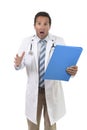 Worried male medicine doctor with stethoscope in medical gown reading clipboard diagnostic stressed Royalty Free Stock Photo