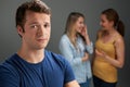 Worried Man Being Talked About By Women Royalty Free Stock Photo