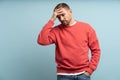 Worried man put hand to forehead. Stressed guy with expression of anxiety, disappointment on face Royalty Free Stock Photo