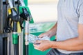 Worried man shocked how much gasoline costs. Royalty Free Stock Photo