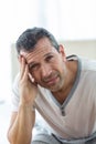 Worried man sitting on bed Royalty Free Stock Photo